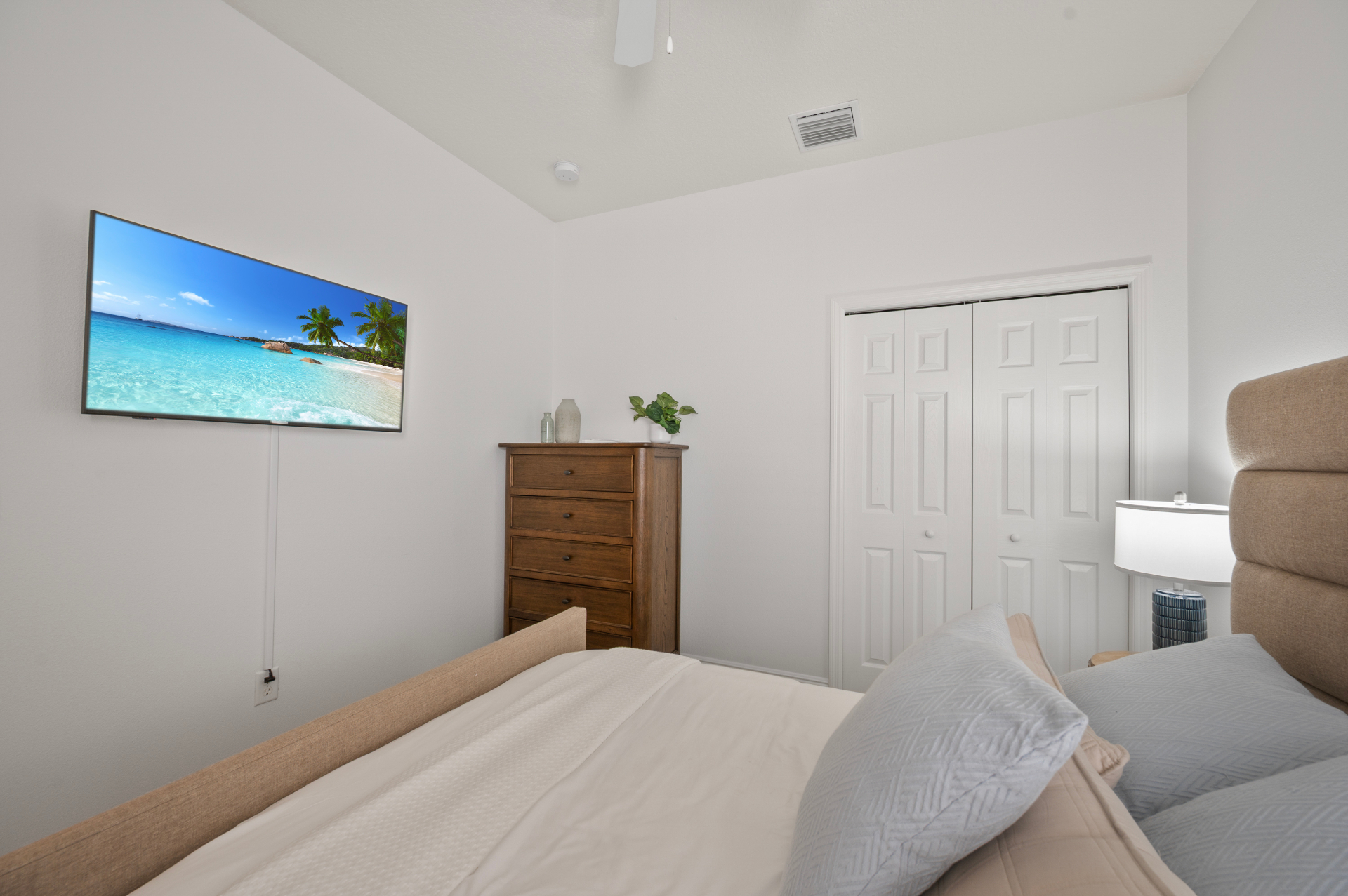 Guest bedroom showing closet wall and dresser storage