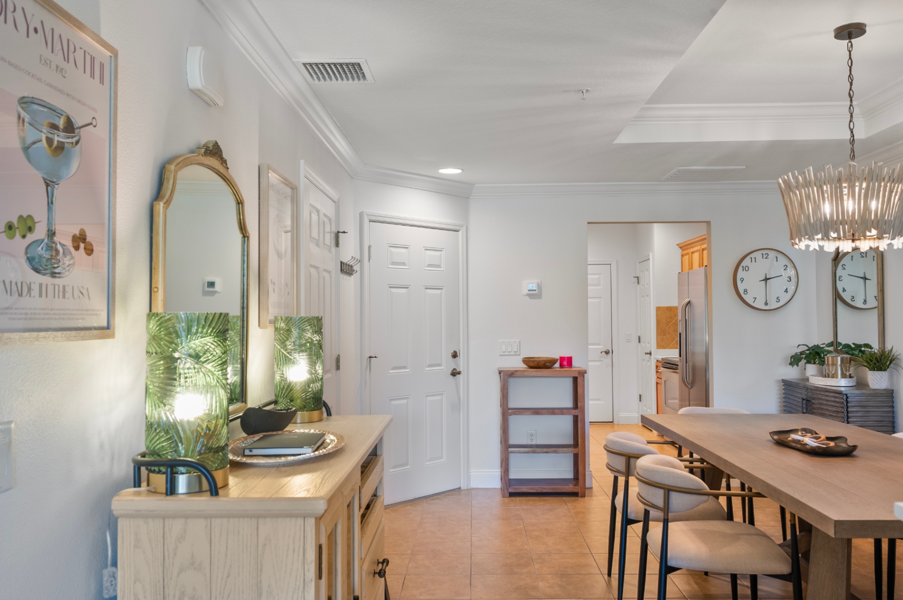 Dining area and front hall with console styling and natural light