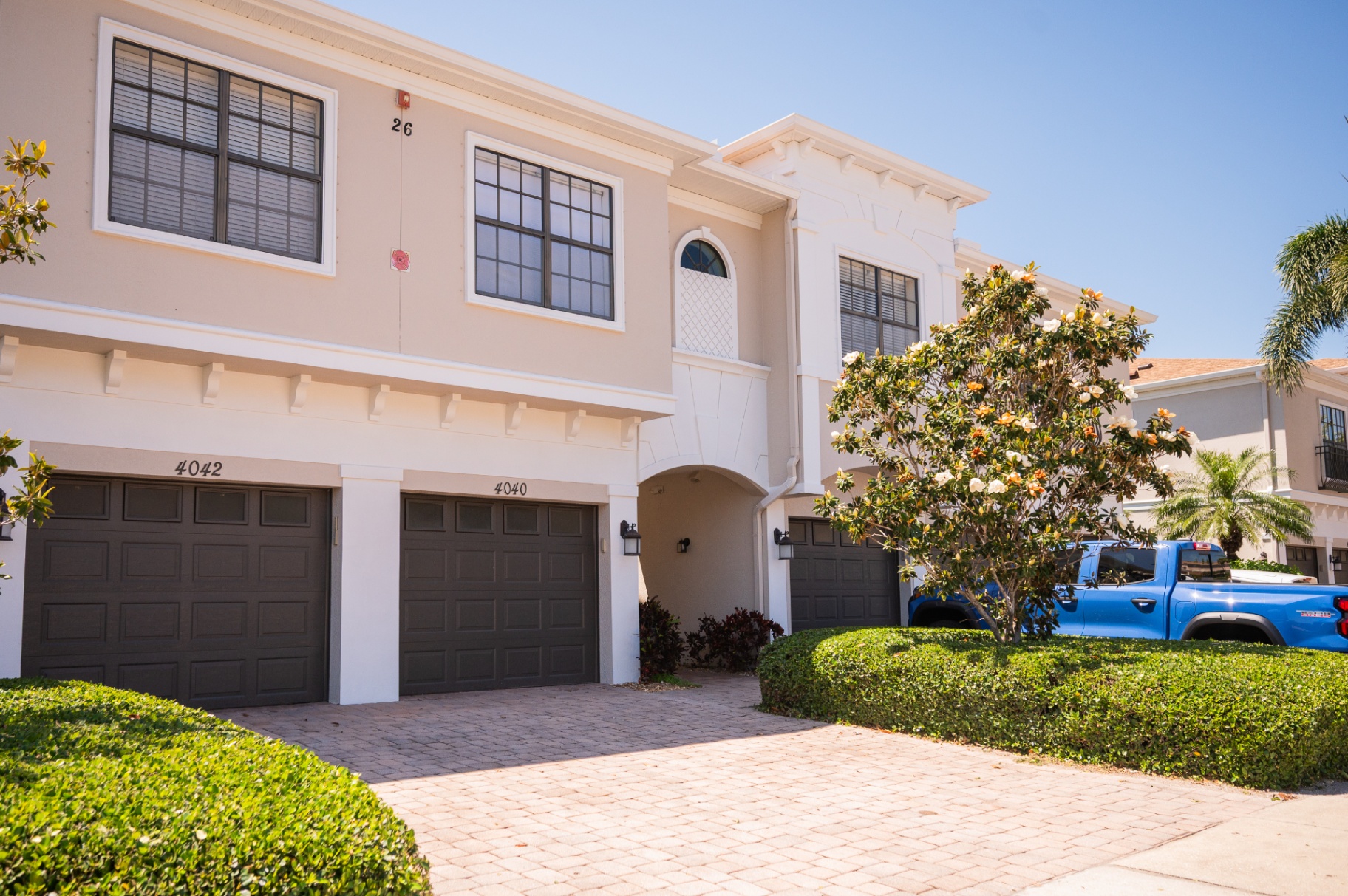 Wide front view of the Bradenton townhome exterior and driveway