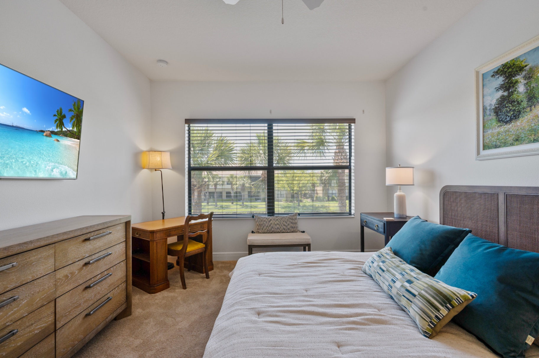 Bedroom showing desk nook and large window